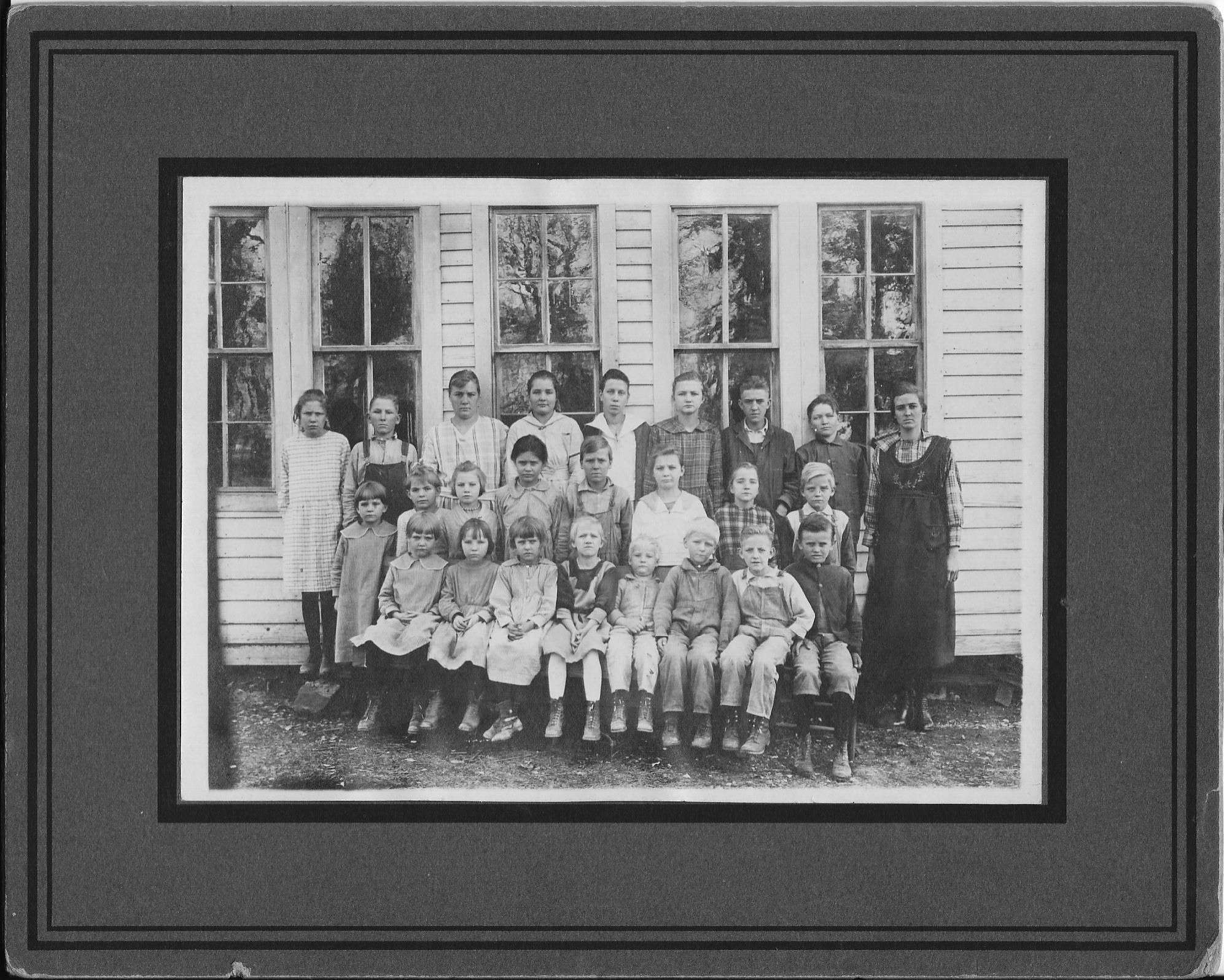 Top row: Mildred Gann, Garret Boyd, Dorothy Gann, Virgie Gann, Sylvia Granes, Pearl Gann, Fred Gann, Herbert Gann, and teacher, Minnie Pinkley. 2nd row: Elmerine Gann, Linna Gann (twin of Lonnie), Gladys Gann, ?? Pinkley, Dalton Gann, Wilma Gann, Vera Gann, Virgil Gann. Bottom row: Margarine Gann, Daisy Gann, ? Pinkley, Ethel Boyd, Cecil Gann, Ralph Gann, Lonnie Gann, ?? Pinkley.